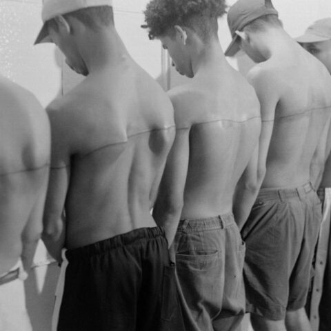 Santiago Sierra, 250 Cm Line Tattooed on 6 Paid People, 1999 (group view). Espacio Aglutinador, Havana, Cuba.